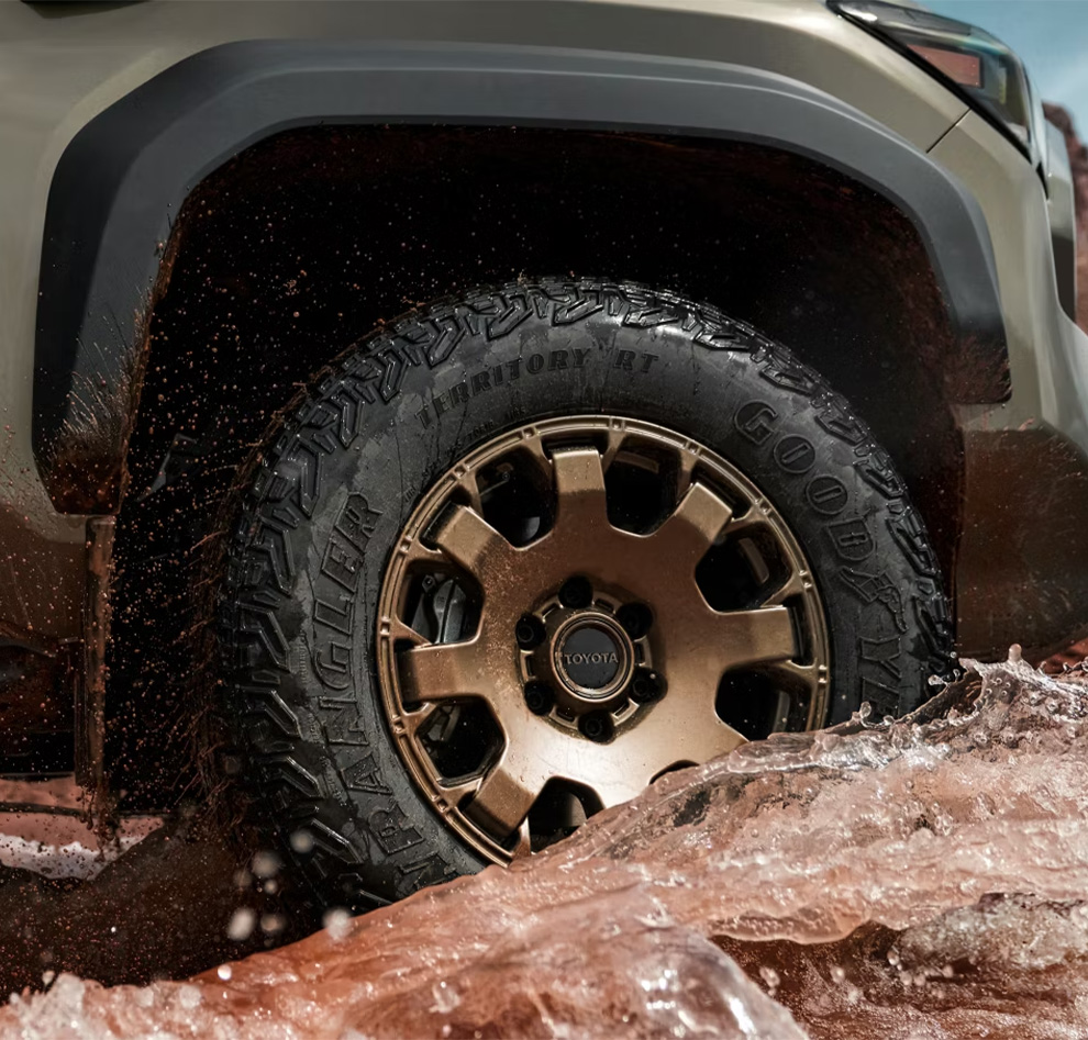 2026 Toyota Tacoma at Delaney Toyota of DuBois in DuBois, PA | Close up of the wheels of a 2026 Toyota Tacoma in a bronze color rim 2026 Toyota Tacoma at Delaney Toyota of DuBois in DuBois, PA | Close up of the wheels of a 2026 Toyota Tacoma in a bronze color rim