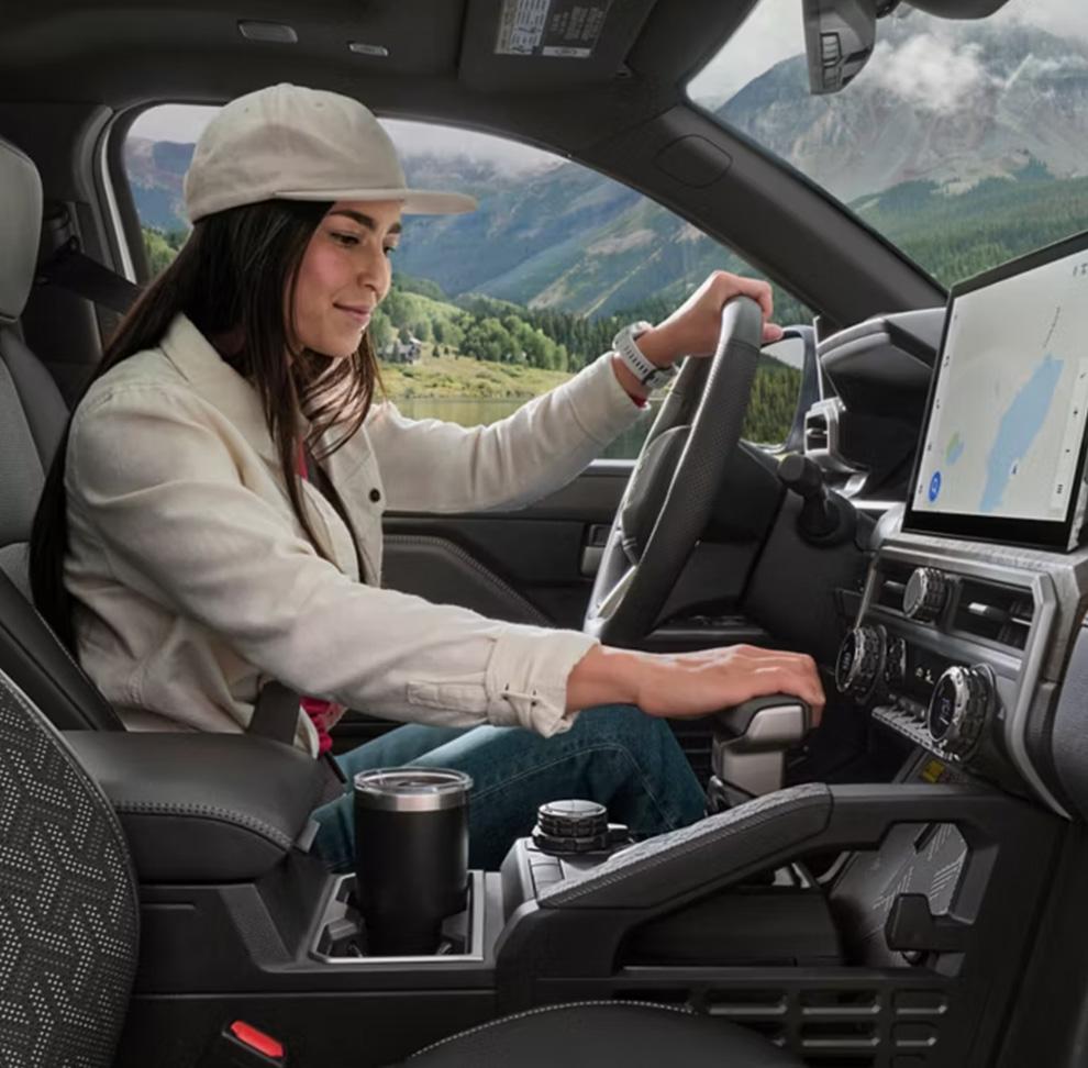 2026 Toyota Tacoma at Delaney Toyota of DuBois in DuBois, PA | Woman sitting in the drivers seat of a 2026 Toyota Tacoma 2026 Toyota Tacoma at Delaney Toyota of DuBois in DuBois, PA | Woman sitting in the drivers seat of a 2026 Toyota Tacoma