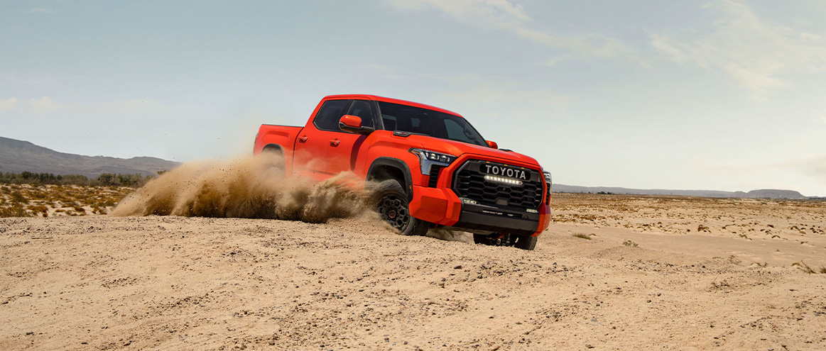 The New 2026 Toyota Tundra at Delaney Toyota of DuBois in DuBois, PA | Orange 2026 Toyota Tundra driving in the dirt The New 2026 Toyota Tundra at Delaney Toyota of DuBois in DuBois, PA | Orange 2026 Toyota Tundra driving in the dirt