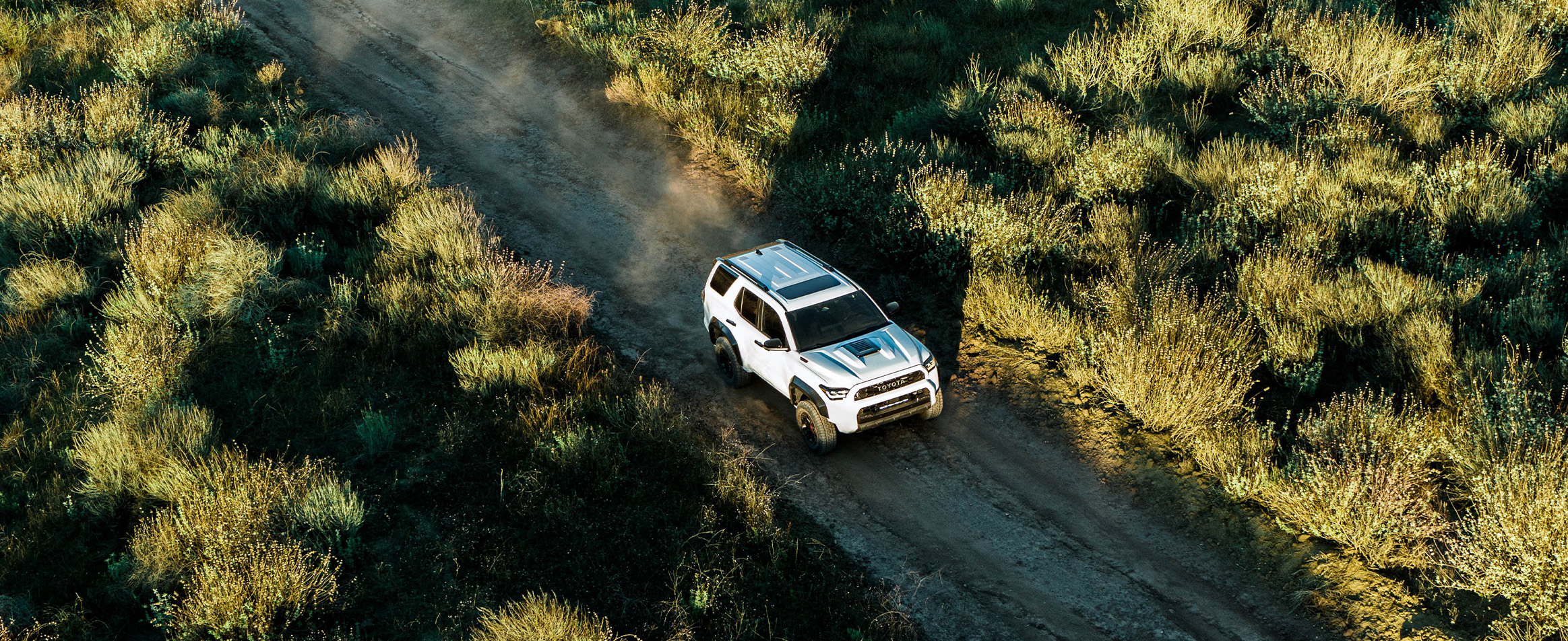 The New 2026 Toyota 4Runner at Delaney Toyota of DuBois in DuBois, PA | Top view of a white 2026 Toyota 4Runner driving up a hill The New 2026 Toyota 4Runner at Delaney Toyota of DuBois in DuBois, PA | Top view of a white 2026 Toyota 4Runner driving up a hill