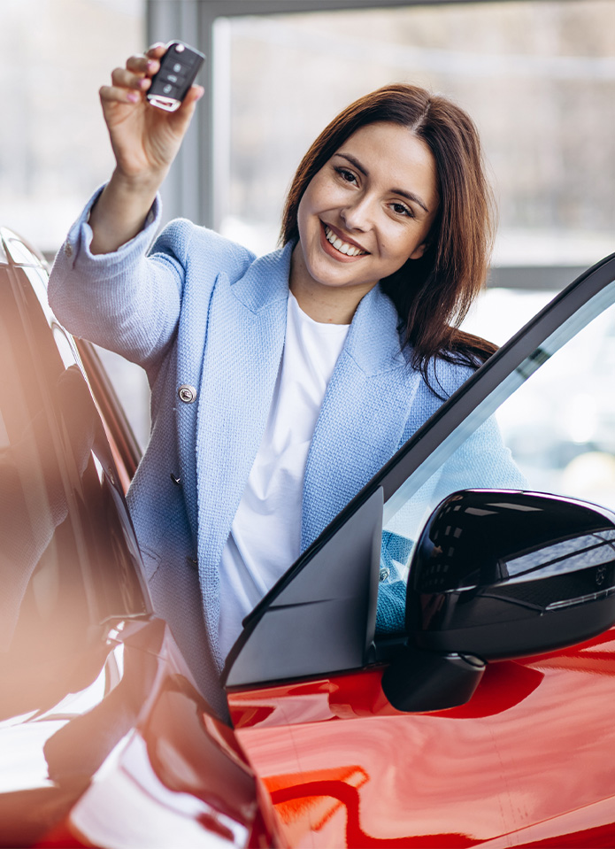 Federal Auto Loan Interest Tax Deduction At Delaney Toyota of DuBois in DuBois, PA | Woman holding new car keys while standing next to her new car in the color red Federal Auto Loan Interest Tax Deduction At Delaney Toyota of DuBois in DuBois, PA | Woman holding new car keys while standing next to her new car in the color red