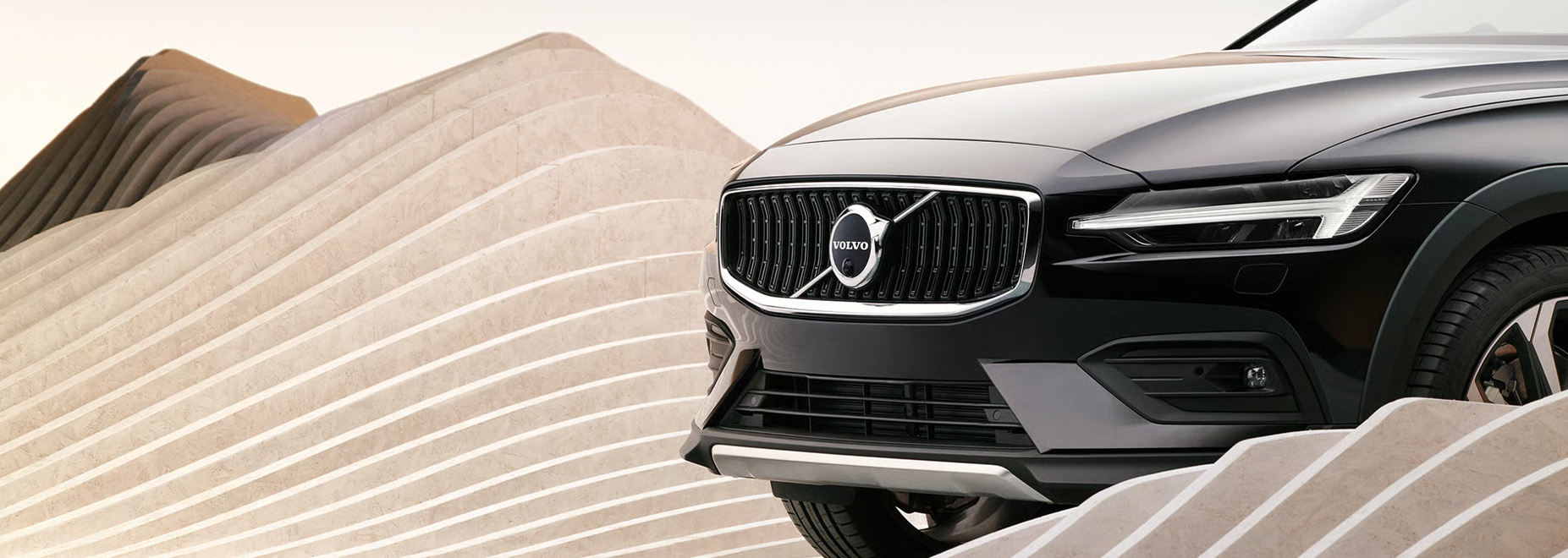 2026 Volvo V60 | Close up of the front bumper and headlights to a 2026 Volvo V60 Cross Country 2026 Volvo V60 | Close up of the front bumper and headlights to a 2026 Volvo V60 Cross Country