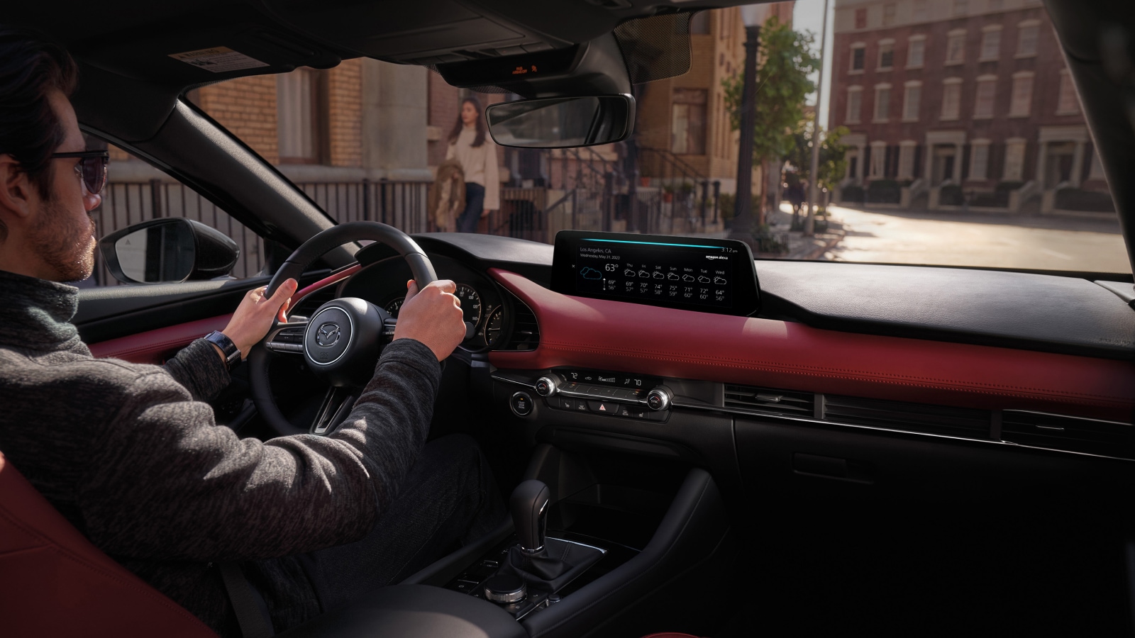 2026 Mazda3 at Lancaster Mazda | Person with both hands on the steering wheel of a 2026 Mazda3