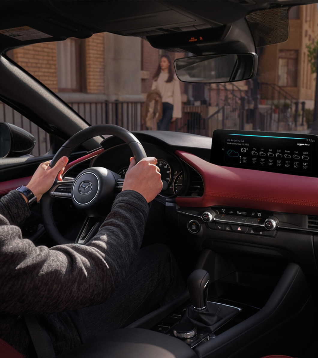 2026 Mazda3 Hatchback at Lancaster Mazda in East Petersburg, PA | Interior of a 2026 Mazda 3 Hatchback with red and black leather 2026 Mazda3 Hatchback at Lancaster Mazda in East Petersburg, PA | Interior of a 2026 Mazda 3 Hatchback with red and black leather