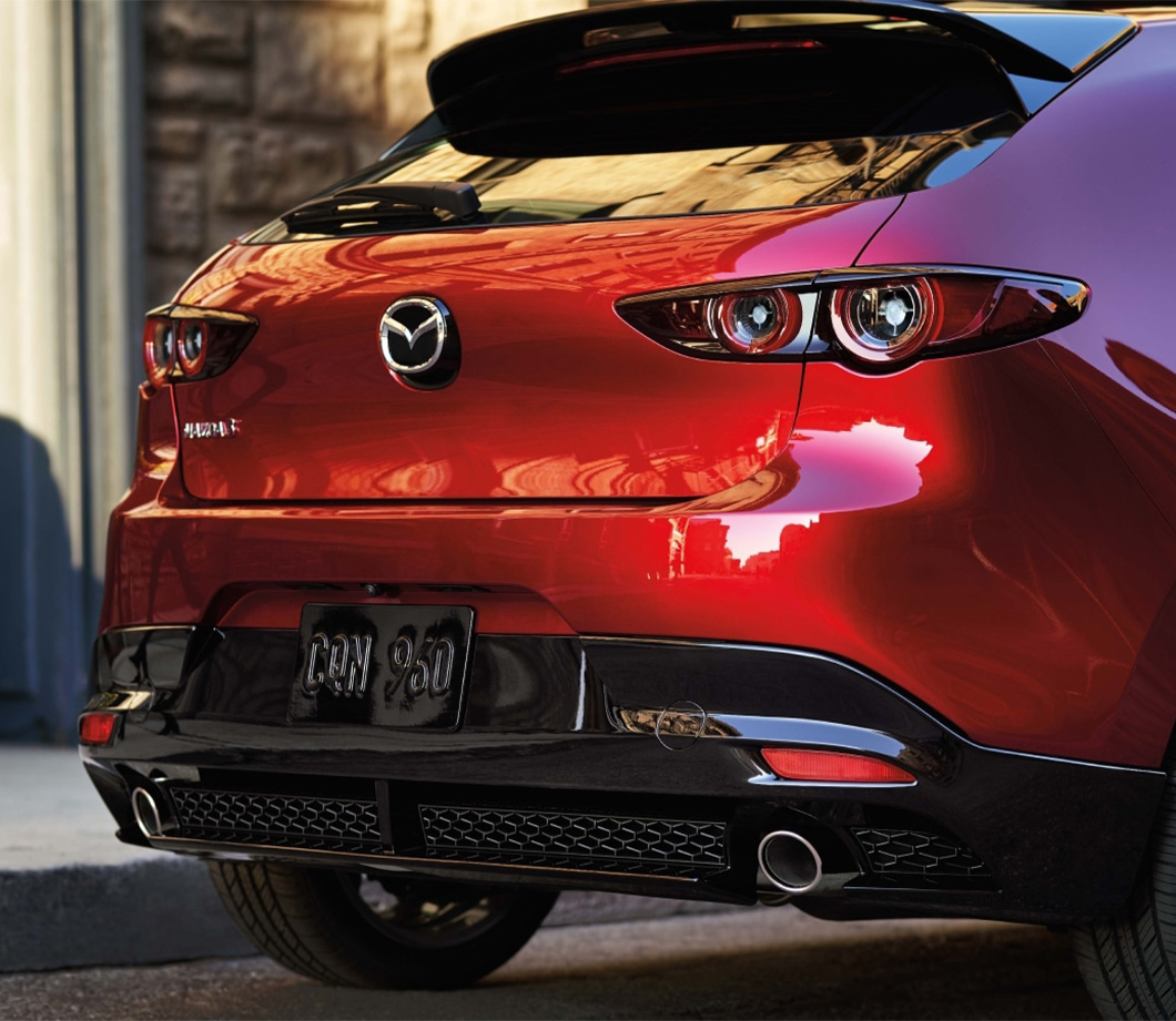 2026 Mazda3 Hatchback at Lancaster Mazda in East Petersburg, PA | Rear taillights and rear bumper to a red 2026 Mazda 3 Hatchback 2026 Mazda3 Hatchback at Lancaster Mazda in East Petersburg, PA | Rear taillights and rear bumper to a red 2026 Mazda 3 Hatchback