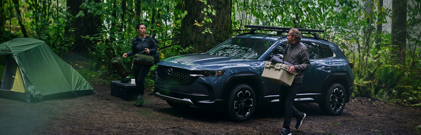2026 Mazda CX-50 at Lancaster Mazda | Couple setting up camp while unloading from their 2026 Mazda CX-50 2026 Mazda CX-50 at Lancaster Mazda | Couple setting up camp while unloading from their 2026 Mazda CX-50