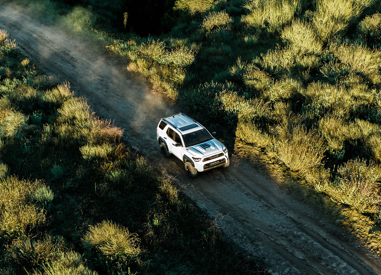 The New 2026 Toyota 4Runner at Lancaster Toyota in East Petersburg, PA | Top view of a white 2026 Toyota 4Runner driving off-road