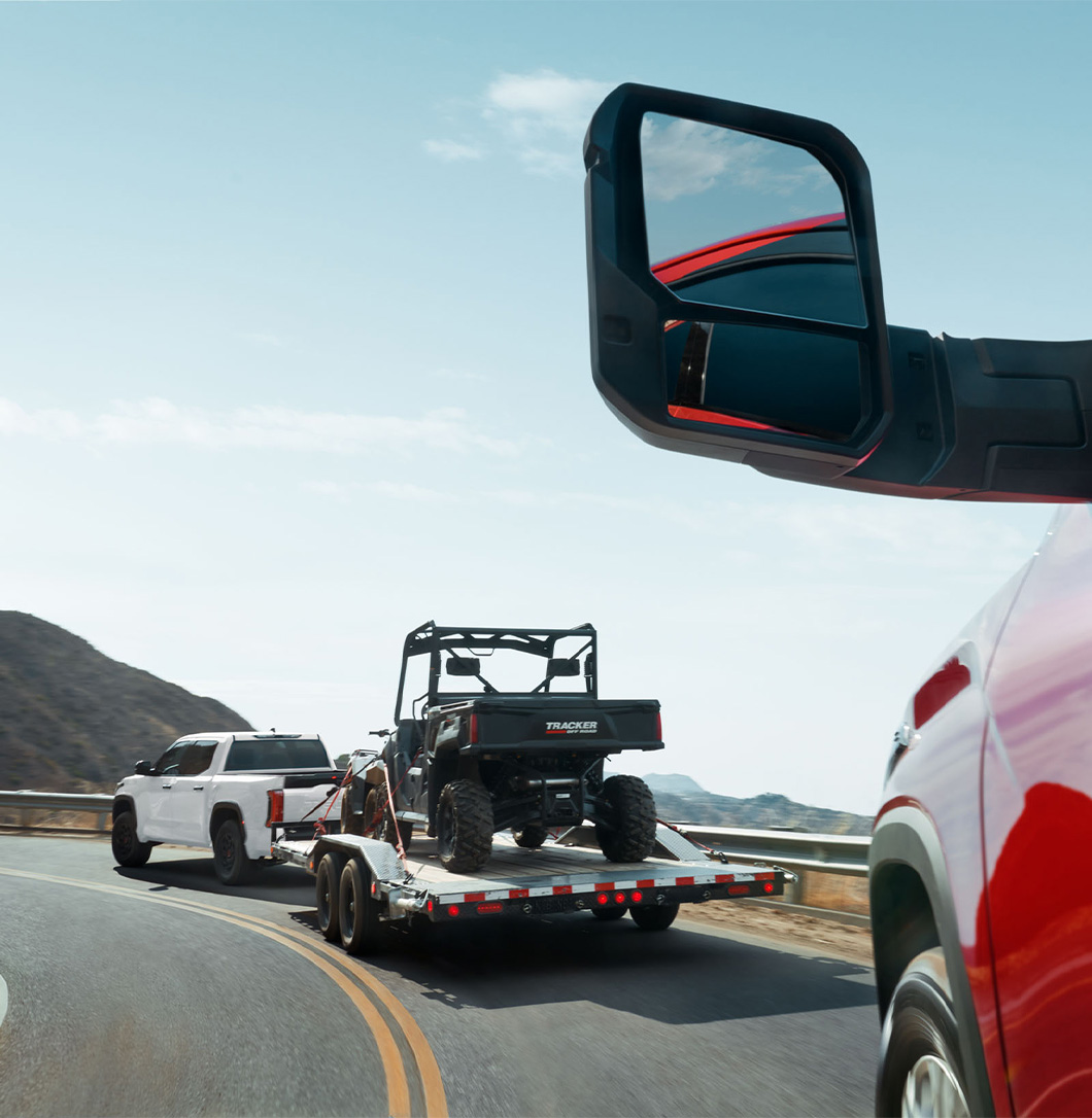 The New 2026 Toyota Tundra at Lancaster Toyota in East Petersburg, PA | White 2026 Toyota Tundra towing a ATV up a curvy hill The New 2026 Toyota Tundra at Lancaster Toyota in East Petersburg, PA | White 2026 Toyota Tundra towing a ATV up a curvy hill