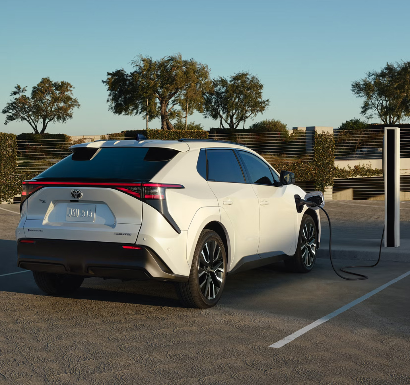 2026 Toyota bZ at Lancaster Toyota in East Petersburg, PA | White 2026 Toyota bZ charging at charging station