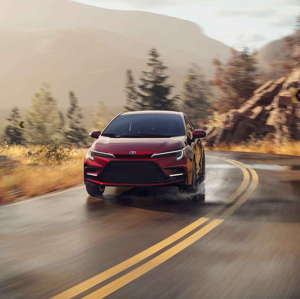 2026 Toyota Corolla vs. 2026 Honda Civic vs. 2026 Nissan Sentra comparison | Lancaster Toyota | Red 2026 Toyota Corolla driving down the road 2026 Toyota Corolla vs. 2026 Honda Civic vs. 2026 Nissan Sentra comparison | Lancaster Toyota | Red 2026 Toyota Corolla driving down the road