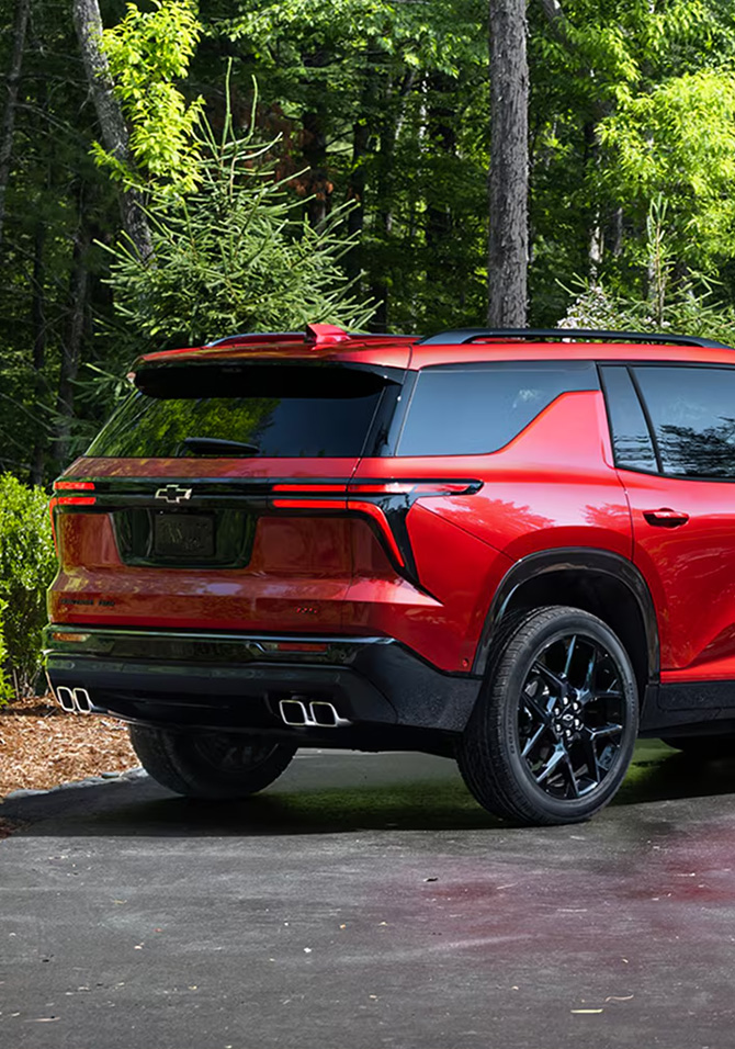 2026 Chevrolet Traverse at Sir Walter Chevrolet | Rear profile of a red 2026 Chevrolet Traverse