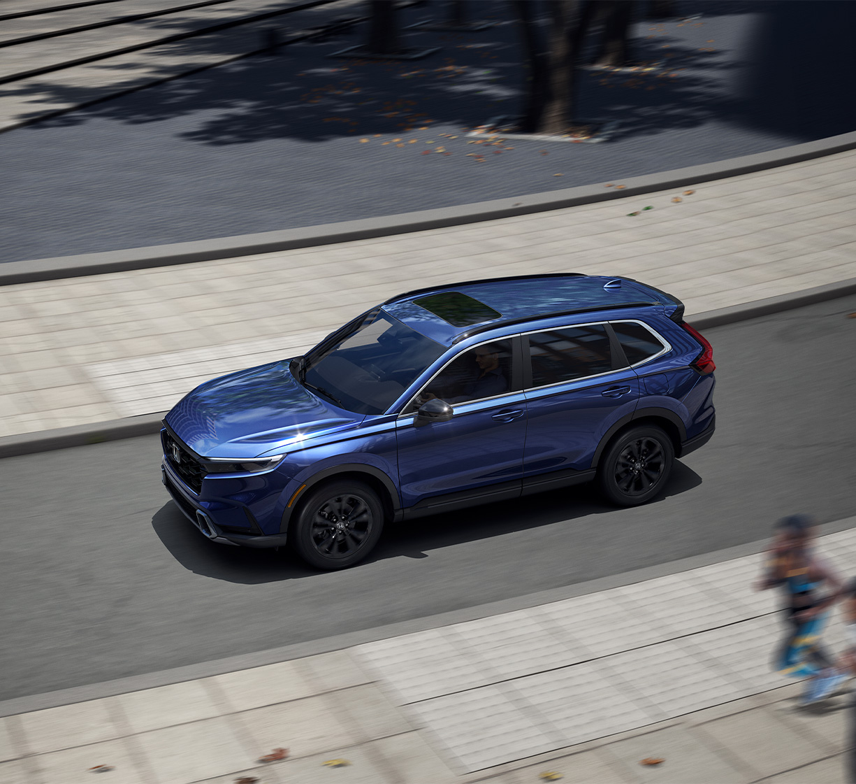 Blue 2026 Honda CR-V driving down the road