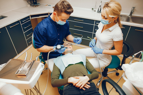 dentist-and-patient-and-dental-assistant-usa-health-insurance-plan