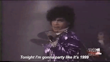 The musician Prince on stage singing, Tonight I'm gonna party like it's 1999.