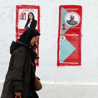 Tunisians trickle in to vote in elections as opposition boycotts