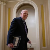 Senate passes temporary spending bill, averting shutdown as talks go on