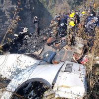 Video shows passenger plane that crashed in Nepal flying low over a populated area before spinning sharply. At least 40 reported killed.