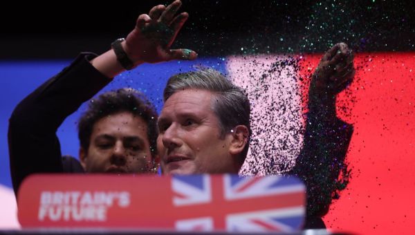 Keir Starmer's speech disrupted as heckler storms stage