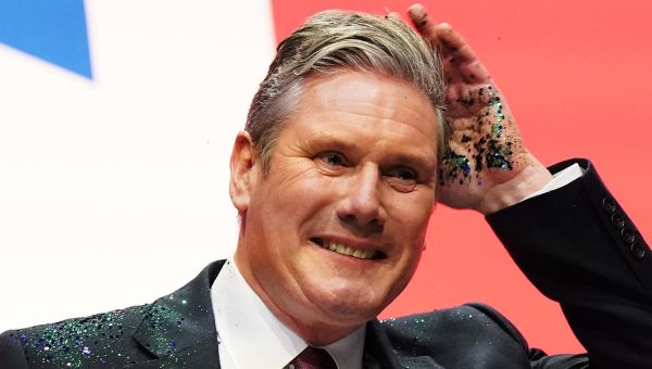 Man arrested after Keir Starmer covered in glitter by heckler on stage