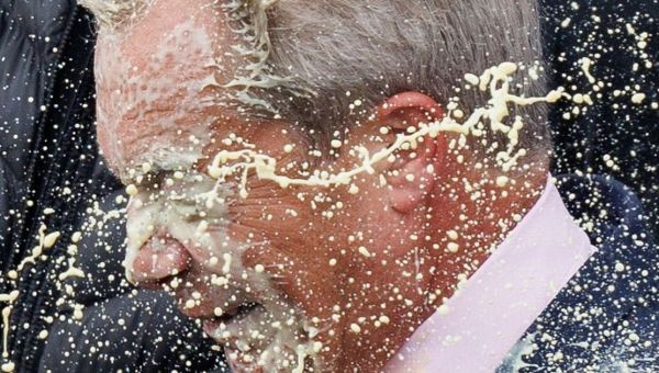 Woman pleads guilty to milkshake attack on Nigel Farage during election campaign