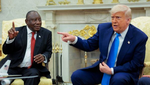 Donald Trump ambushes South African president with clips of 'genocide' - live