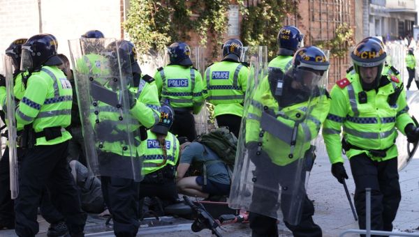 Jeering rioters surround injured female officer saying ‘she deserves it’