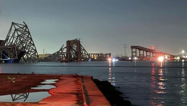 Chilling moment cop calls for ‘everybody’ to help as bridge suddenly collapses
