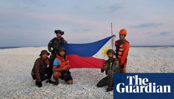 China and Philippines display competing flags on disputed South China Sea sandbank