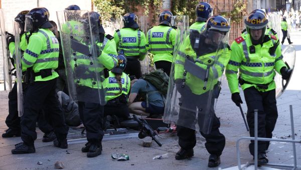 Violent protests across UK see officers injured as bricks and bottles thrown