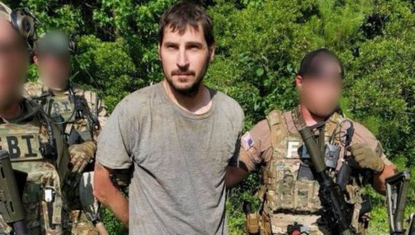 ‘Worn out’ murder suspect arrested ‘at gunpoint’ after nine-days on the run