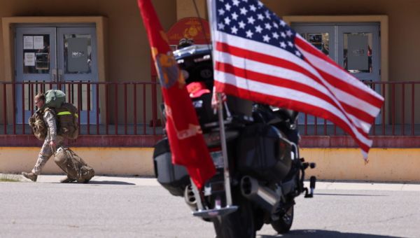 A U.S. Marine used political connections to adopt an Afghan baby, her family says. Now they’re suing to get her back.