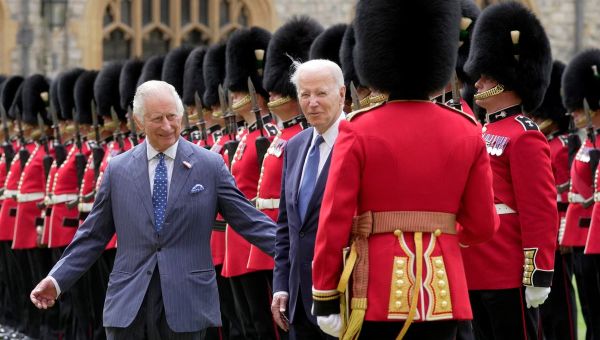 Awkward moment as Charles moves Biden on during chat with guardsman