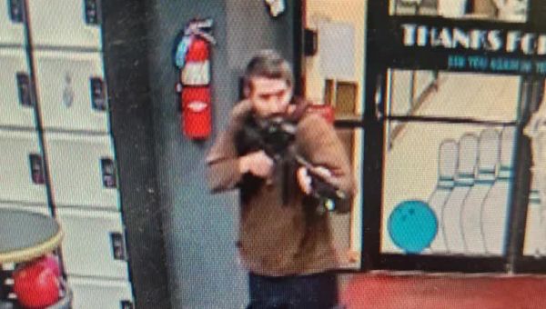 At least 22 dead in Maine mass killing and police hunt for the shooter as residents take shelter