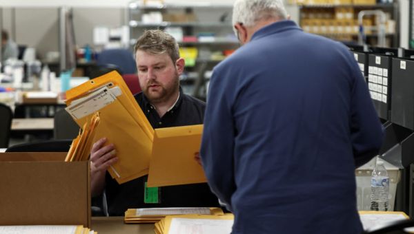 Voting hours extended at five polling places in Georgia’s Fulton County disrupted by bomb threats