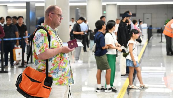 U.S. eases China travel advisory after 3 detained Americans are released