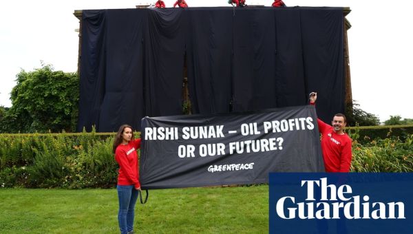 Greenpeace protesters drape giant oil-black fabric over Sunak’s mansion