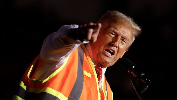 Trump trolls Harris, Biden with garbage truck press conference