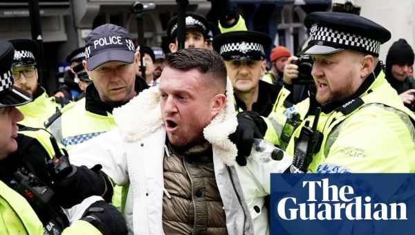 Tommy Robinson arrested at march against antisemitism in London