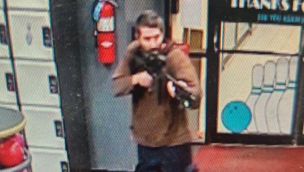 22 people dead and 60 injured with armed suspect still at large in mass-shooting