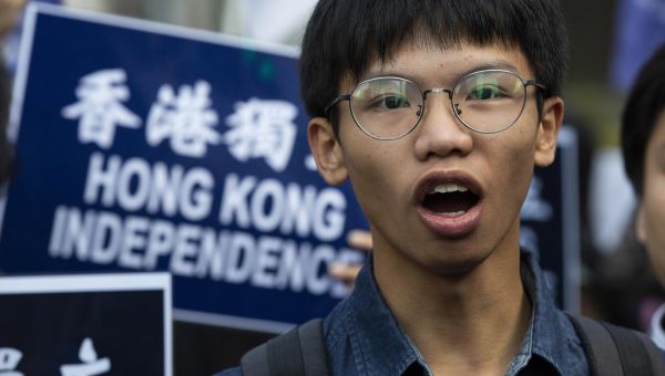 Pro-democracy activist flees Hong Kong, seeks UK asylum