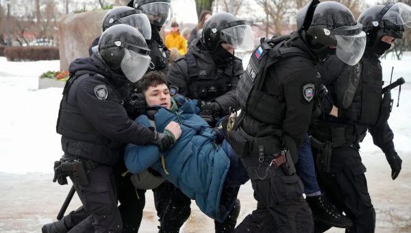 Police in Russia detain hundreds in protests against Navalny’s death