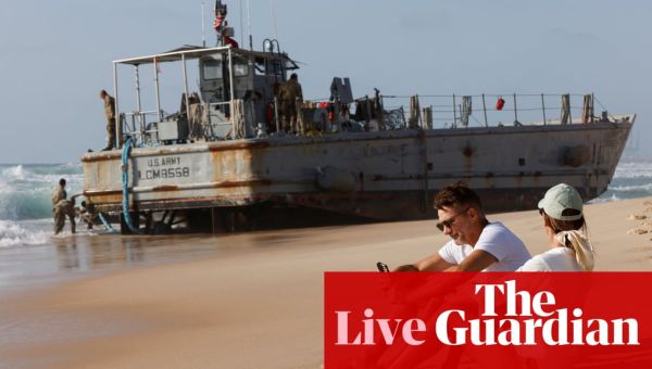 Israel-Gaza war live: two US army boats supporting Gaza aid pier run aground in bad weather