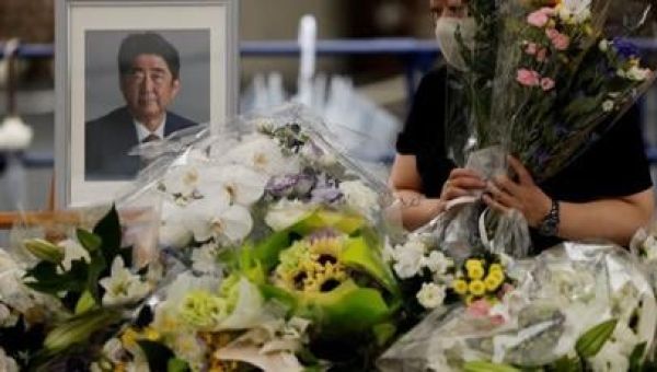 With flowers and a gun salute, Japan bids farewell to Abe at state funeral