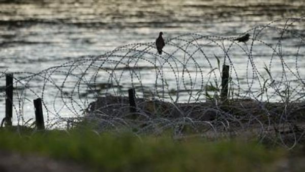 Judge orders federal agents to stop cutting Texas razor wire for now at busy Mexico border crossing