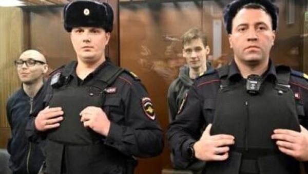 Two Russians get prison terms for poetry against Ukraine campaign