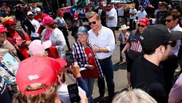 Outside MSU stadium, Trump fans rally for candidates