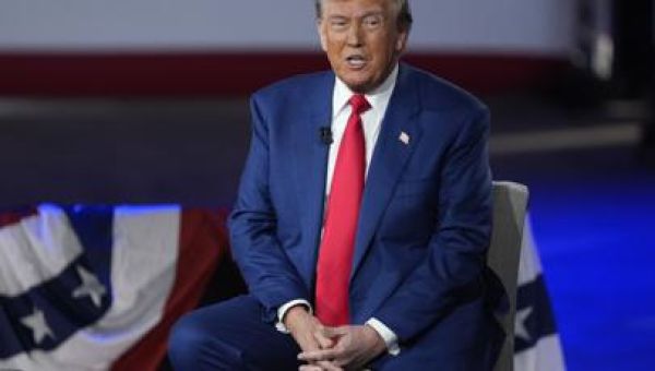 Trump says he'll boost the economy by cutting federal spending and corporate taxes