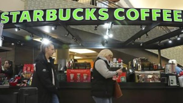 Starbucks workers begin strikes that could spread to hundreds of US stores by Christmas Eve