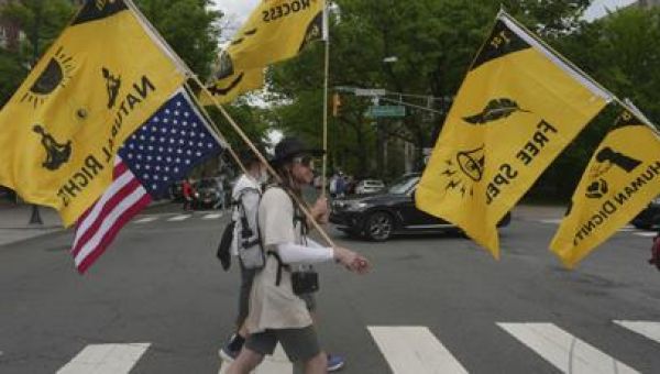 Quakers march against Trump’s crackdown on immigrants, carrying on long faith tradition