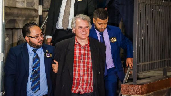 Obama’s ex-National Security Council advisor smiles during perp walk